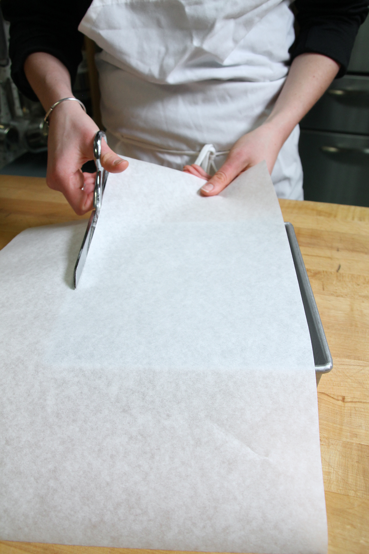 Baking with a parchment paper sling via @kingarthurflour