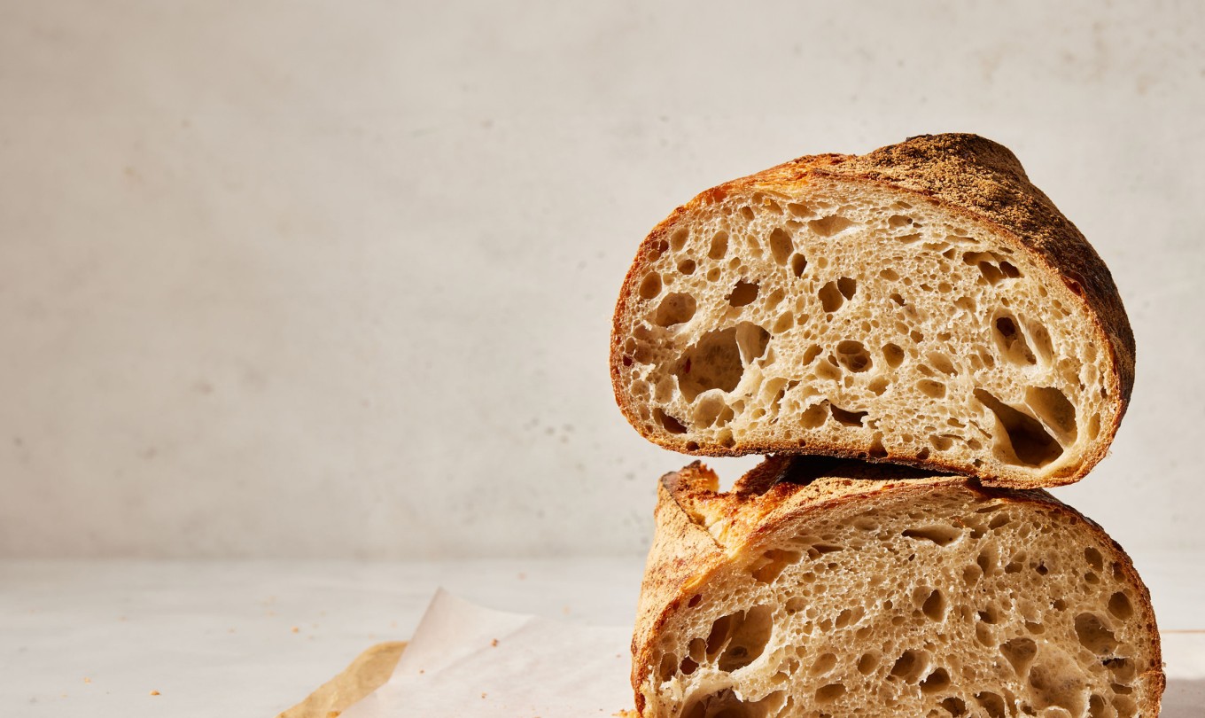 Two sides of cut sourdough loaf stacked on top of each other